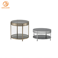 Table basse ronde à double niveau avec rangement, plateau en verre trempé noir et structure circulaire en acier inoxydable, style contemporain