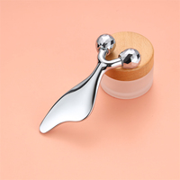 Masseur de beauté portable en acier inoxydable, outil 2-en-1 de roulement et de raclage pour la définition de la ligne du menton, la réduction des rides et la relaxation