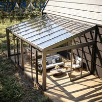 Véranda en aluminium à économie d'énergie avec profilés à rupture de pont thermique et vitrages doubles pour réduire les coûts de chauffage et de climatisation