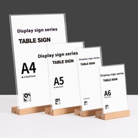 Carte de table en acrylique A4 moderne avec base en bois Panneau de table debout écologique pour l'affichage de décrochage Panneau de menu Panneau publicitaire