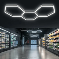Lumière de garage hexagonale LED à lumen élevé Éclairage diffus polyvalent Options de montage au mur/plafond pour garages de stationnement