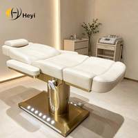Table de massage électrique réglable pour salon de beauté avec base en métal pour usage hôtelier