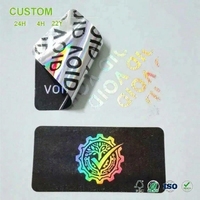 Étiquettes de sécurité VOID personnalisées avec base noire et film holographique argenté, impression VOID répétitive pour l'étiquetage des cartons et des boîtes