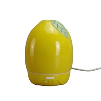 Handgemaakte glanzende porseleinen citroen aroma diffuser, luchtbevochtiger met frisse citrusolie en slimme timerinstellingen