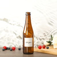 Botella de Vidrio Redonda Marrón Semitransparente de 250 ml y 550 ml para Vino, Bebidas y Cerveza, con Tapa Corona y Logotipo Personalizado