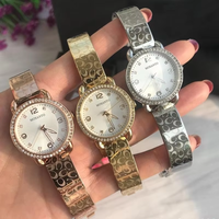Montre pour femme avec lunette en cristal, cadran en nacre or rose, grands chiffres, élégante, à quartz, résistante à l'eau, cadeau
