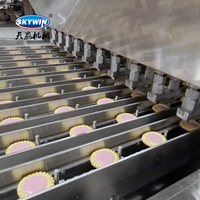 Machine à fabriquer des tartelettes et des biscuits Skywin avec système de dépose de confiture au chocolat et tunnel de refroidissement