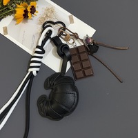 Porte-clés en cuir avec breloque sac, motif pain et chocolat, style simple et circulaire