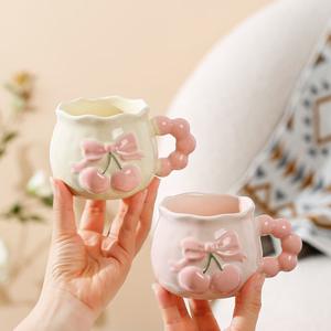 Tazza in Ceramica Dipinta a Mano con Rilievo di Ciliegie Rosa, Design Estetico per Caffetterie e Bevande Calde - Product Image 1