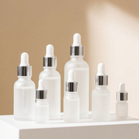 Flacon compte-gouttes en verre fantaisie 10ml 20ml 50ml 100ml flacon cylindrique d'huile essentielle givrée avec compte-gouttes
