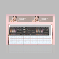 Mobilier de boutique de soins de la peau personnalisé rose présentoir de magasin de cosmétiques Led Island Cabinet pour magasin magasin de cosmétiques Design d'intérieur