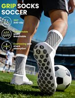 Chaussettes de sport en coton antidérapantes respirantes et rembourrées pour jeunes, idéales pour le football et l'entraînement (ODM)