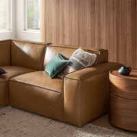 Canapé modulaire de luxe sur mesure en L, en cuir véritable, éponge haute densité, design de style européen, texture raffinée, passepoil contrastant pour