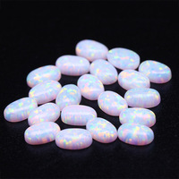 Cabochons d'opale blanche de qualité OP17 Opale de feu synthétique à fond plat en forme d'oeuf Gemmes en vrac pour bagues Forme de pierre précieuse ovale