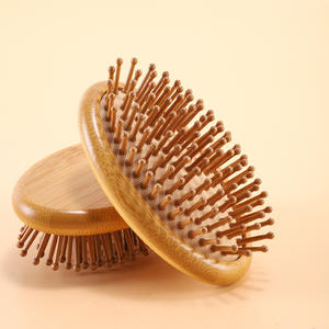 Cepillo de masaje capilar de madera de nanmu con cojín elástico para el cuidado de los meridianos de la cabeza y un cabello suave - Product Image 5