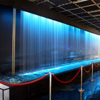 Fuente de Cascada Moderna de Acero Inoxidable Optimum Show con Luces LED Multicolores y 2 Años de Garantía para Jardines y Restaurantes al Aire Libre