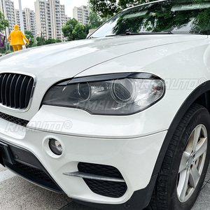 สติ๊กเกอร์ติดคิ้วไฟหน้ารถยนต์สีดำเงา/ลายคาร์บอน สำหรับ BMW X5 E70 ปี 2008-2013 - Product Image 4