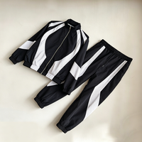 Ensemble survêtement coupe-vent homme noir et blanc color block, grande taille, veste et pantalon en nylon, style Gorpcore Streetwear, personnalisable OEM ODM, tendance