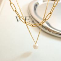 Collier pendentif en acier inoxydable personnalisé en usine, collier de perles d'eau douce, collier chaîne de perles plaqué or pour femmes
