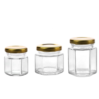 Bocaux à miel hexagonaux transparents bouteilles en verre de miel uniques ou bocaux en verre hexagonaux pour miel