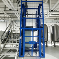 Plateforme élévatrice verticale fixe pour marchandises, sur rail, robuste et personnalisée, pour le transfert de matériaux en entrepôt