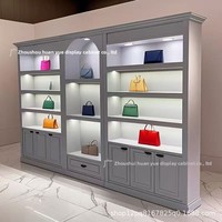 Vitrine de magasin de centre commercial, salle d'exposition, meuble de présentation de sacs autoportant, pré-assemblé, personnalisable, laqué, style luxe léger