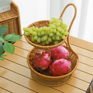 Keranjang Buah & Rak Penyimpanan Camilan Bulat Dua Tingkat Gaya Rotan Mewah Ringan dari PP untuk Ruang Tamu dan Meja Kopi Rumah - Product Image 1