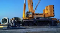 Grue tout-terrain à 7 essieux, flèche principale de 90,5 m, système de double alimentation, forte capacité de levage, adaptabilité élevée pour les grands projets de levage en construction