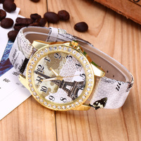 Montre analogique à quartz pour femme, style vintage, tour Eiffel de Paris, avec fleur, boîtier en alliage, verre en cristal et bracelet en cuir