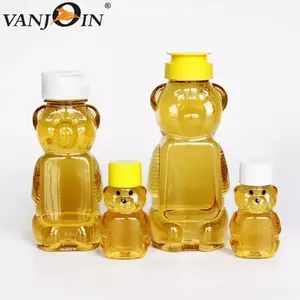 Personnaliser 330g 500g de haute qualité boisson jus sauce PET presser les bouteilles de miel en plastique en forme d'ours avec bouchons à rabat