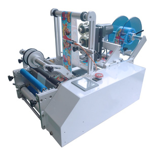 Machine d'étiquetage manuelle pour bouteilles de vin rondes, bouteilles et canettes pour les industries alimentaires et commerciales, avec nouveau manuel en promotion - Product Image 1