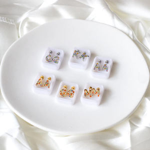 Boucles d'oreilles minimalistes en acier inoxydable plaqué or 18 carats pour femmes, à rayures verticales ovales - Product Image 1