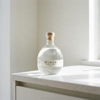 Solution d'agence de conception intégrée : Bouteille en verre en forme de tête de gorille pour emballage de spiritueux, idéale pour les achats de Noël et les fêtes.