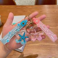 Mignon Dessin Animé Liquide Acrylique En Plastique Porte-clés Bébé Poupée Porte-clés 3d Poupée Sac Pendentif Porte-clés En Gros