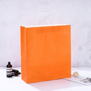 ถุงกระดาษหรูหราสีส้มออกแบบได้ตามต้องการบรร<span class=keywords><strong>จ</strong></span>ุภัณฑ์ถุงกระดาษคราฟท์ทรงสูงขนาดใหญ่สำหรับใส่เสื้อผ้า - Product Image 2