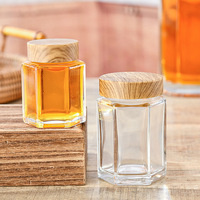 Prix de gros Bocal en verre hexagonal transparent haut de gamme de qualité alimentaire Bocaux en verre hexagonal de 180ml avec couvercles