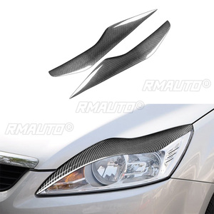 ฝาครอบตกแต่งไฟหน้ารถยนต์คาร์บอนไฟเบอร์แท้ 1 คู่ สำหรับ Ford Focus 2 MK2 ปี 2008 2009 2010 อุปกรณ์ตกแต่งรถยนต์ - Product Image 1