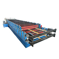 Machine de formage à froid de panneaux de toiture et de paroi en acier double couche
