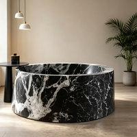 Baignoire double autoportante de luxe en marbre noir rond, baignoire en pierre naturelle pour hôtel et villa ultra-luxe