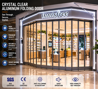 Porte pliante moderne en cristal pour PC, avec design étanche, idéale pour les entrées de centres commerciaux et les installations commerciales