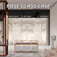 Vitrine murale en verre couleur rose pour bijoux avec serrure et éclairage LED en acier inoxydable