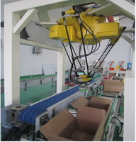 Système de palettisation industriel Delta Spider Robot pour l'emballage de cartons, avec robot de préhension et placement de cartons, et système de chargement par le haut