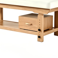 Table de massage en bois durable et élégante, blanche, avec coussin de tête et tiroir, idéale pour les salons de beauté, les spas, les hôtels, les gymnases et les salons.