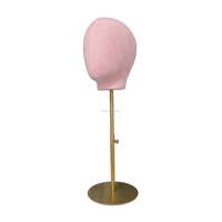 Tête de mannequin femme en fibre de verre rose de luxe avec pose debout pour la présentation visuelle en magasin
