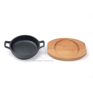 Vente de gros <span class=keywords><strong>Plat</strong></span> à <span class=keywords><strong>gratin</strong></span> rond en fonte Assiette Fajita avec socle en bois - Product Image 2