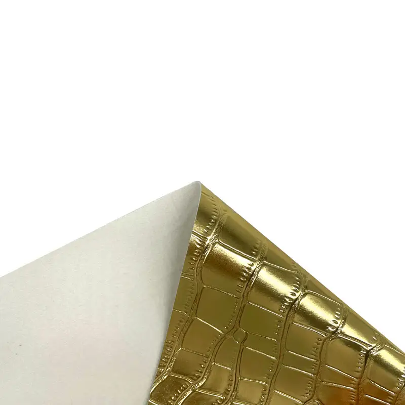 ไวนิลม้วนผ้าพีวีซีเทียมลายจระเข้สีเงินทองมีในสต็อกสำหรับกระเป๋านุ่ม