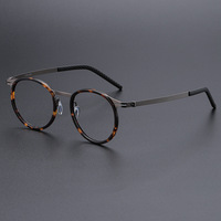 Lunettes de vue universelles à monture ronde en alliage de titane avec verres optiques en plastique pour hommes et femmes