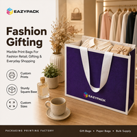 Sacs en papier personnalisés avec logo, impression marbrée, poignées en ruban et emballage personnalisé pour la vente au détail