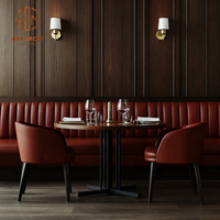 Ensemble de meubles de restaurant moderne : table ronde en bois, banquette demi-cercle en cuir rouge, table et chaises