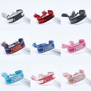 สายรัดข้อมือทอพู่ห้อยปักชื่อ ปักโลโก้ตามสั่ง สำหรับงานอีเว้นท์ - Product Image 6